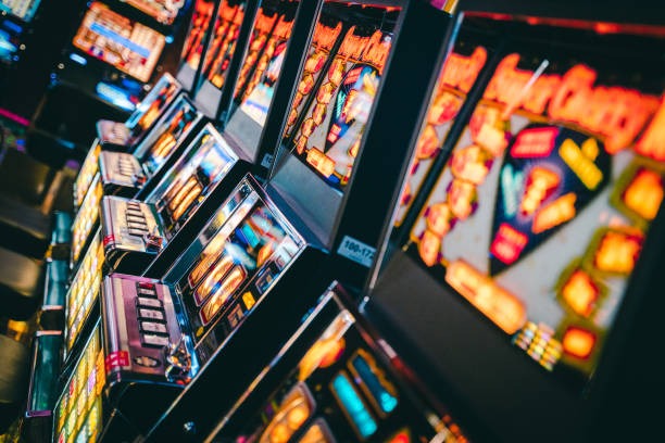 Boom City live dealer studio with multiple camera angles and real dealers at blackjack and roulette tables